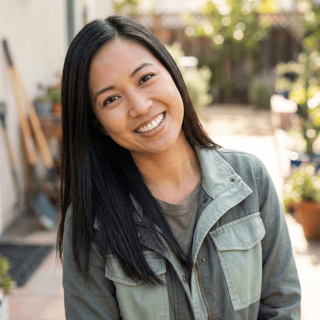 Female customer service coordinator in her late 20s at a service desk